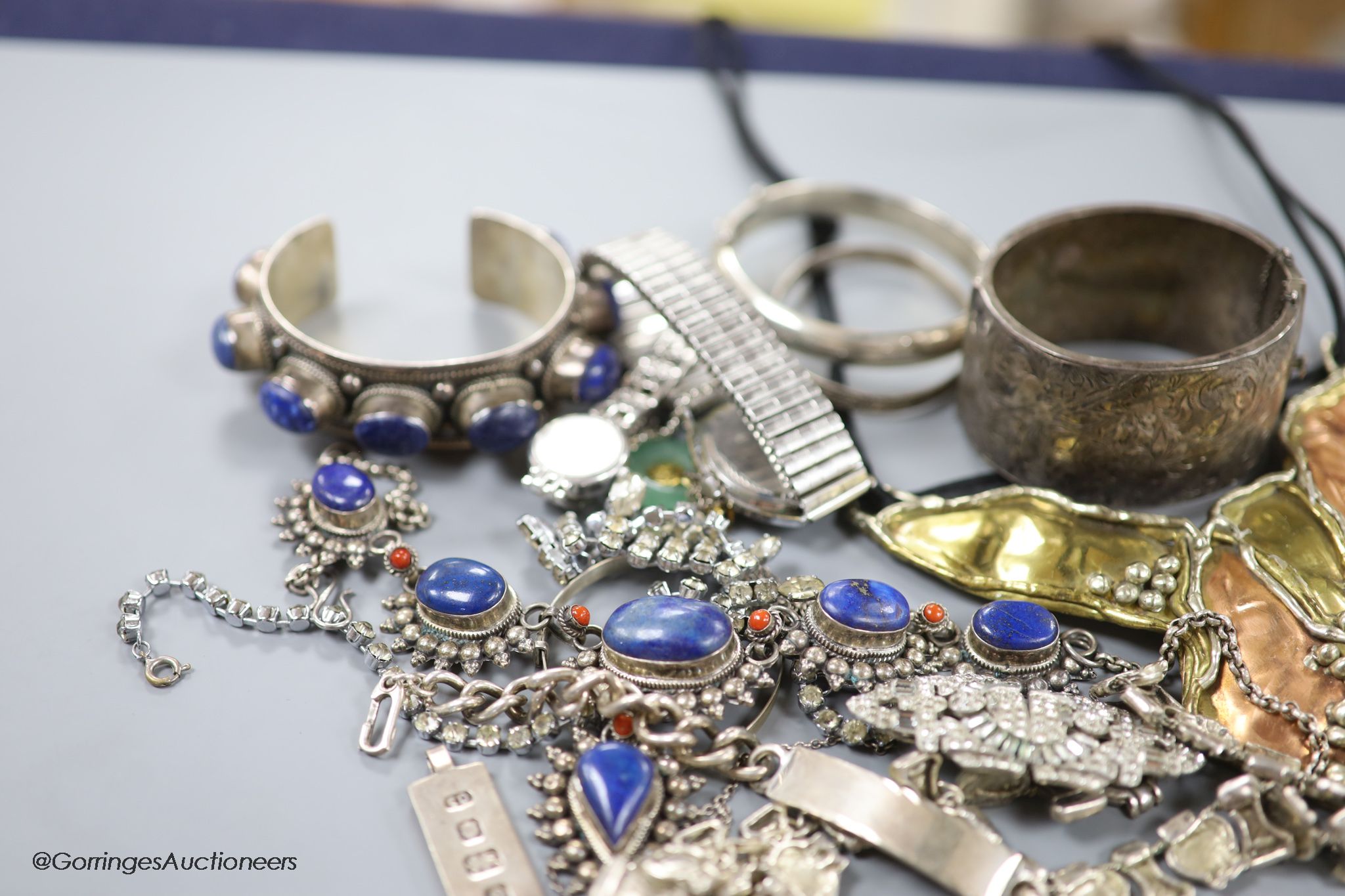 A collection of mixed silver and other costume jewellery.